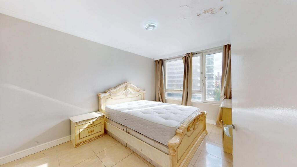 Bright and spacious double bedroom featuring a ...