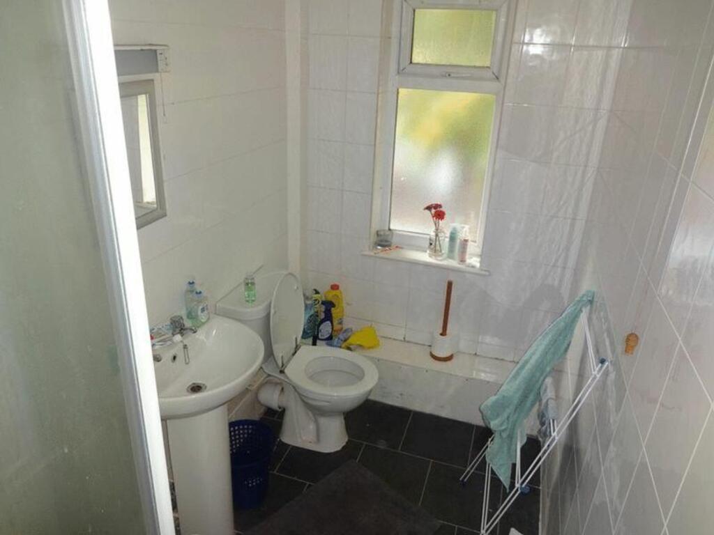 A functional and tidy bathroom with natural lig...