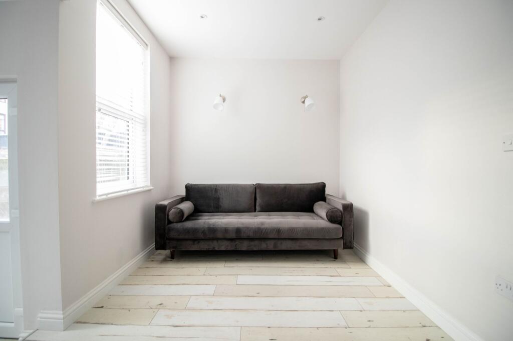 A bright and airy living room featuring a moder...