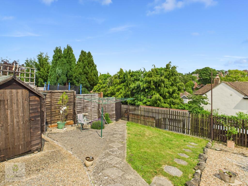 Rear Garden Looking Towards Garage And Parking