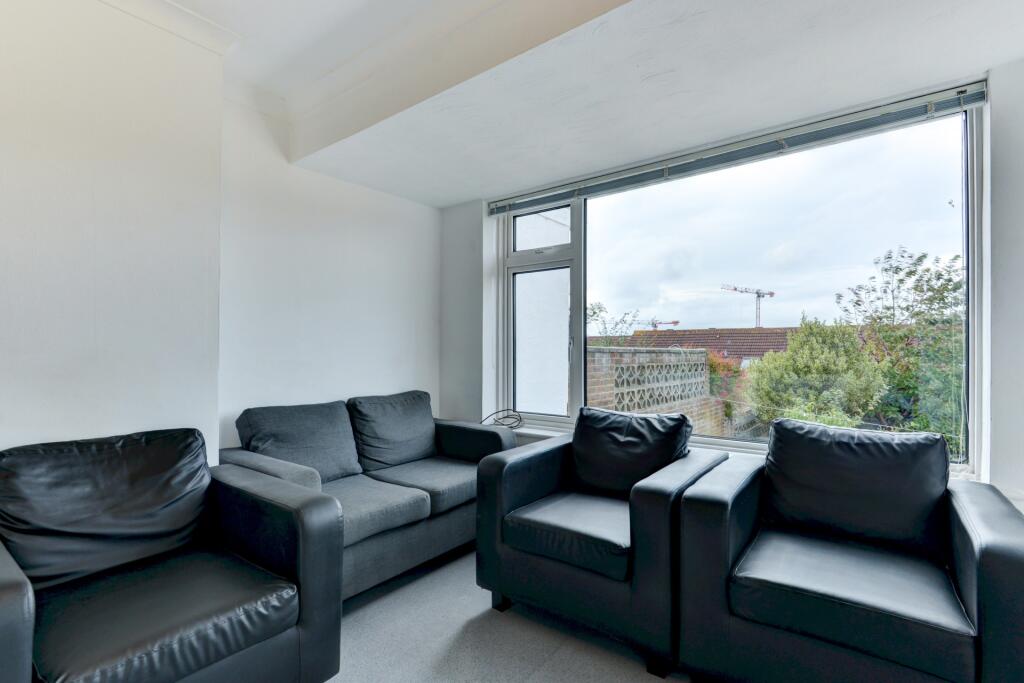 A modern living room featuring a set of comfort...