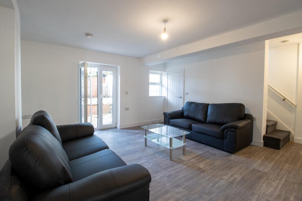 A bright and spacious contemporary living room ...