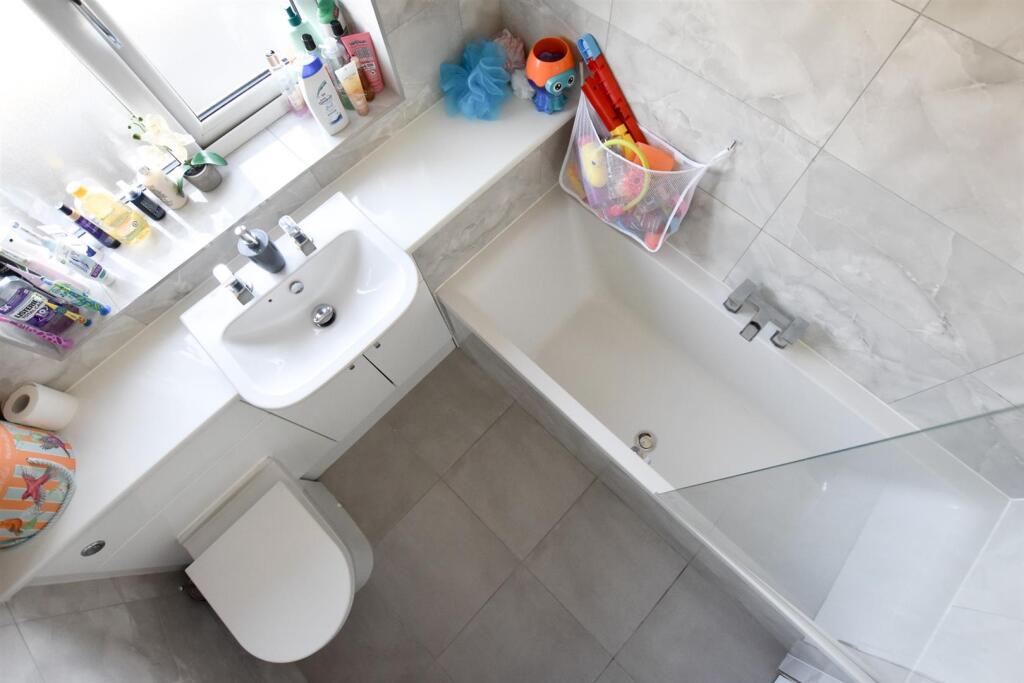 FAMILY BATHROOM WITH SHOWER OVER