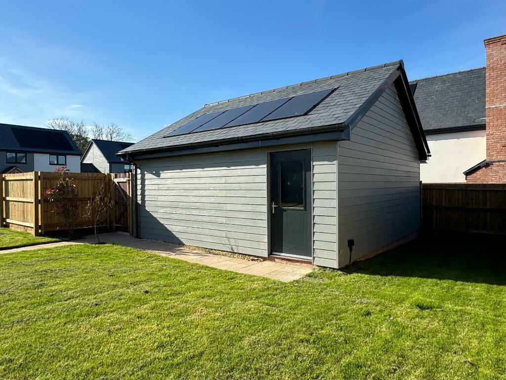 Garage with side access from the garden