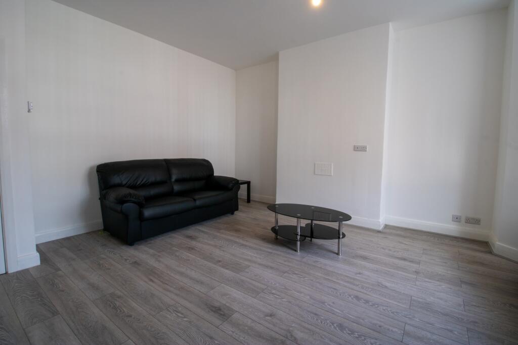 A spacious and well-maintained living area feat...