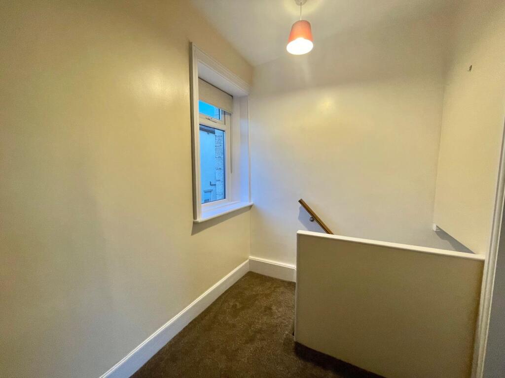TO THE FIRST FLOOR LANDING