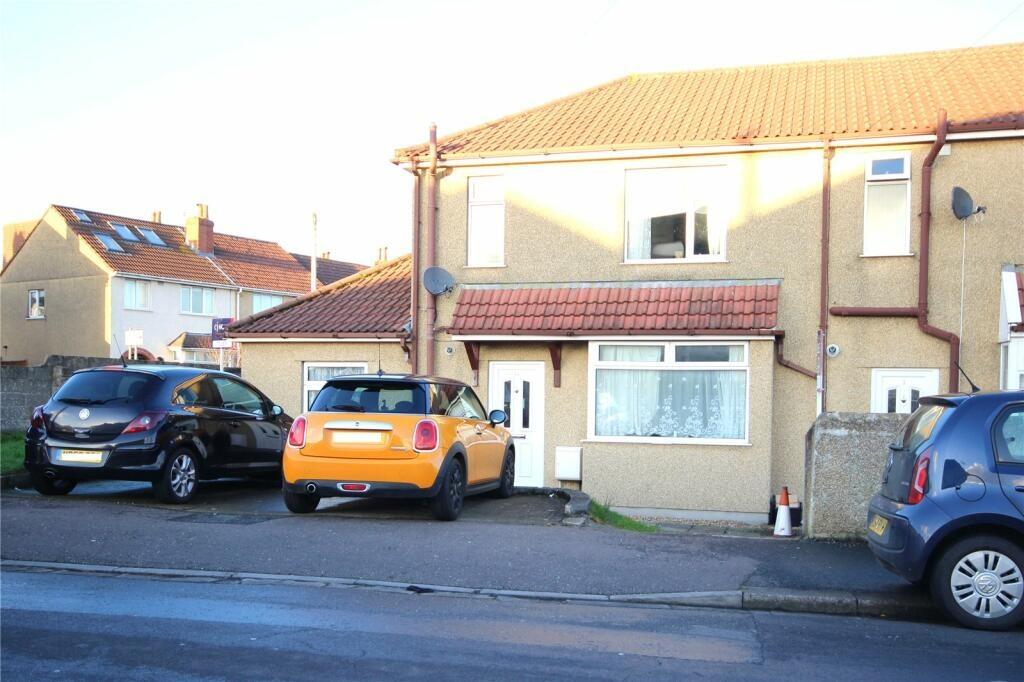 A neat front view of a semi-detached house with...