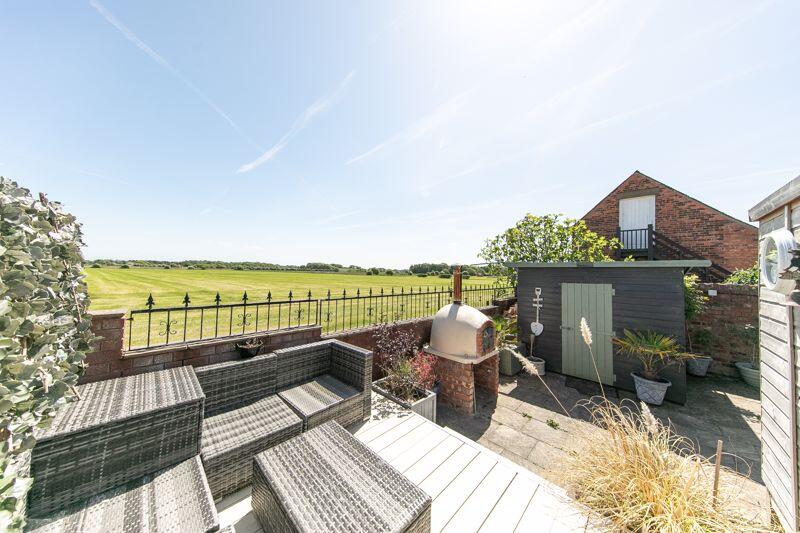 Open aspect view, shed and pizza oven