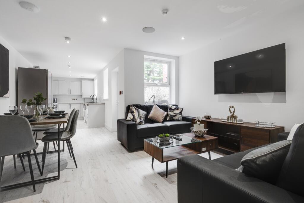 A spacious and stylish modern living room perfe...