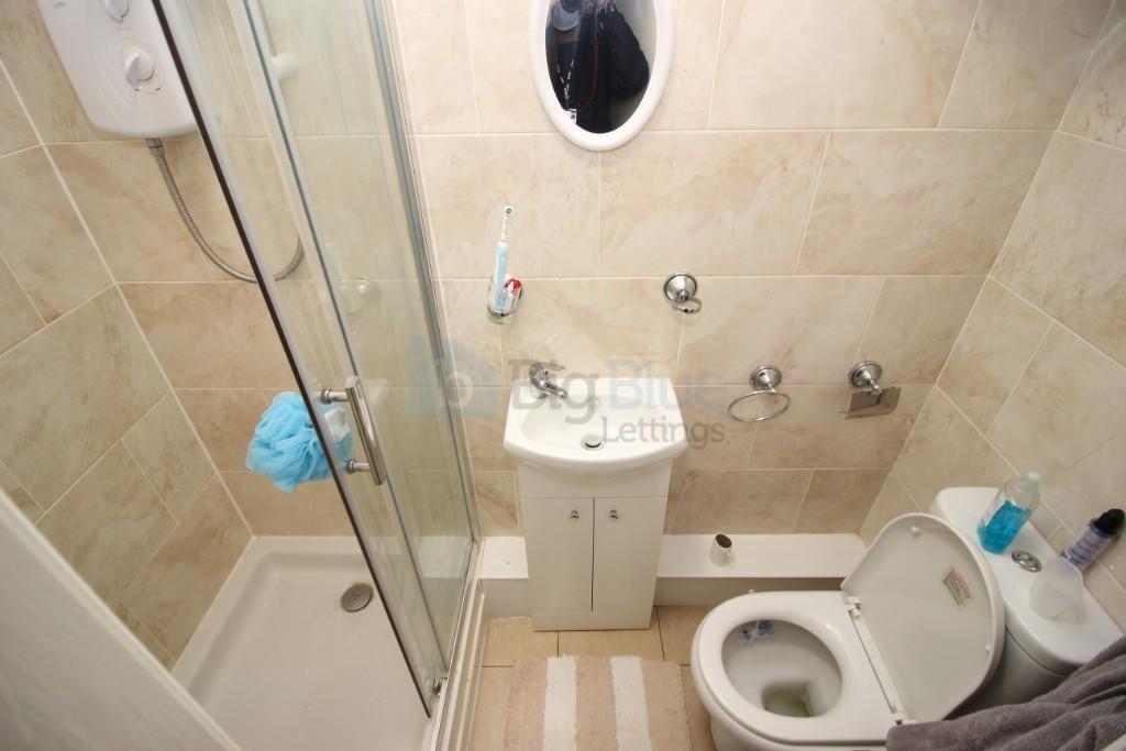 A compact and well-maintained bathroom featurin...