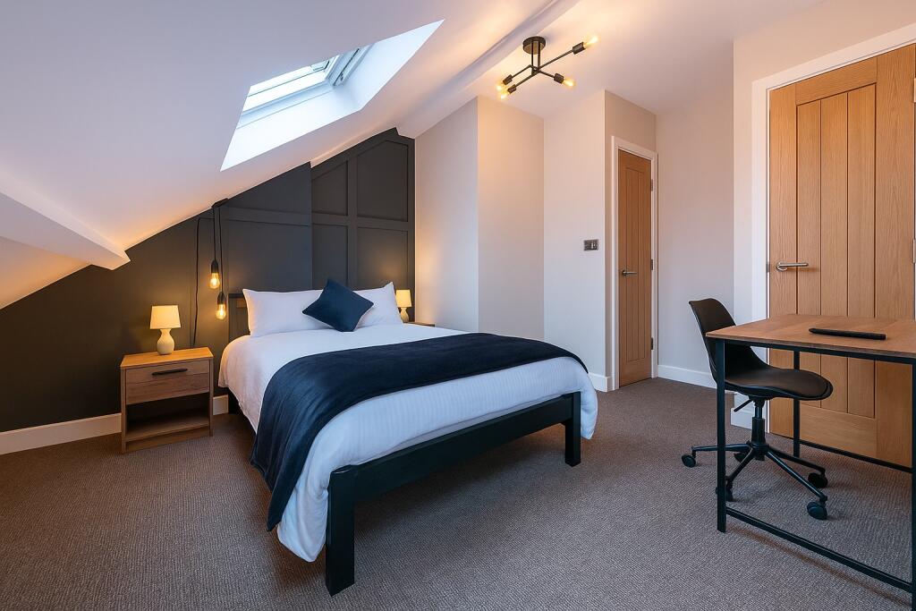 A modern and inviting master bedroom featuring ...