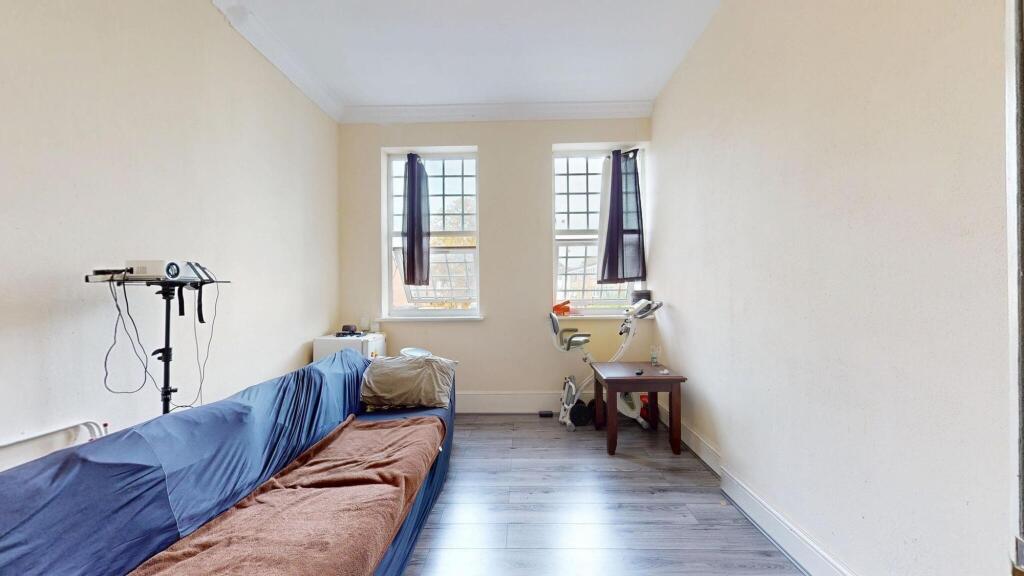 Bright and straightforward living room with two...