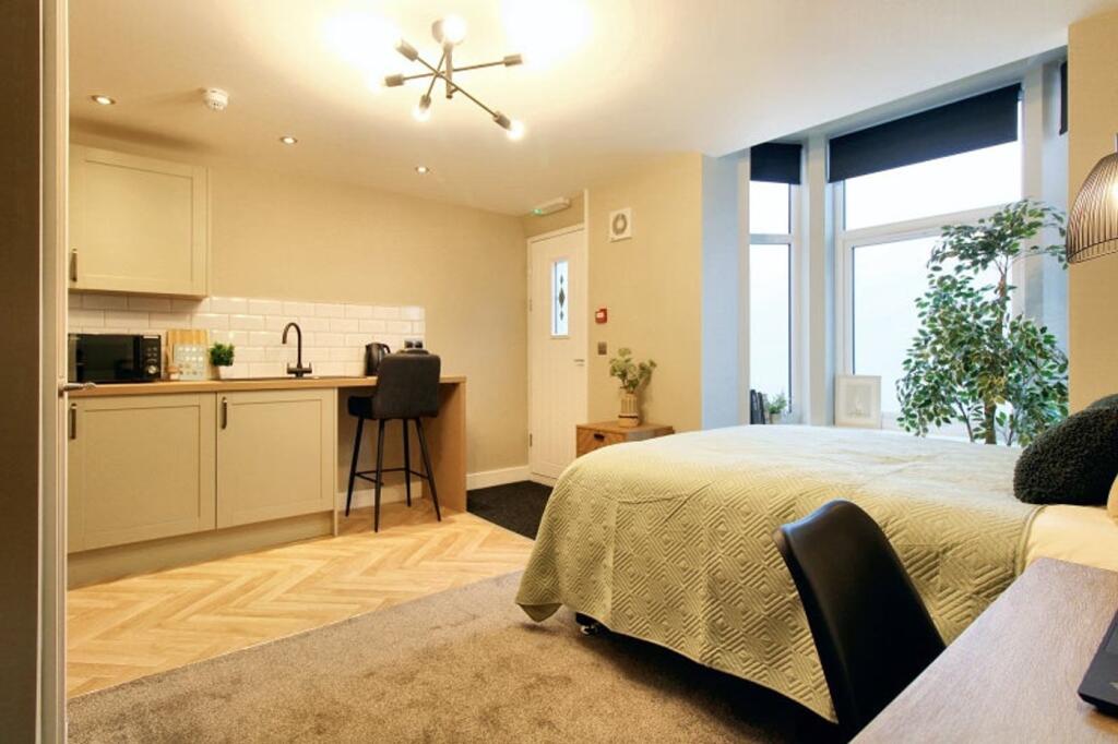 Bright and inviting double bedroom featuring a ...