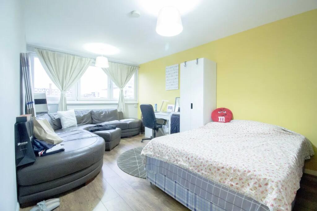 Bright and inviting master bedroom featuring a ...