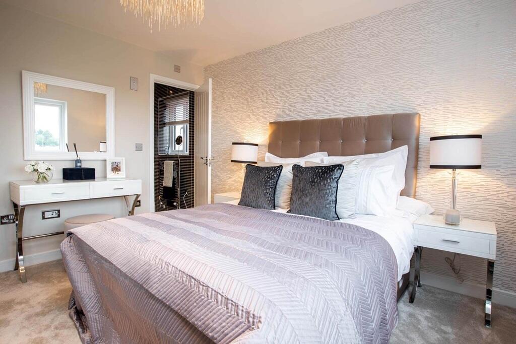 The main bedroom features and en suite shower room