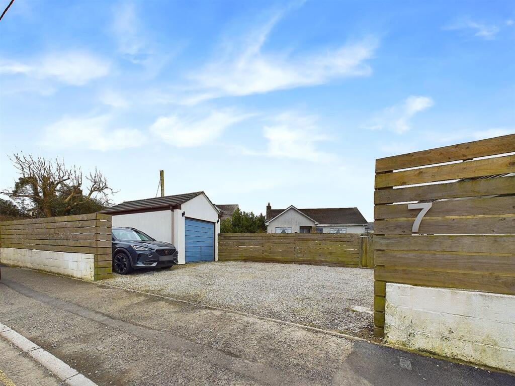 Entrance, garage and parking
