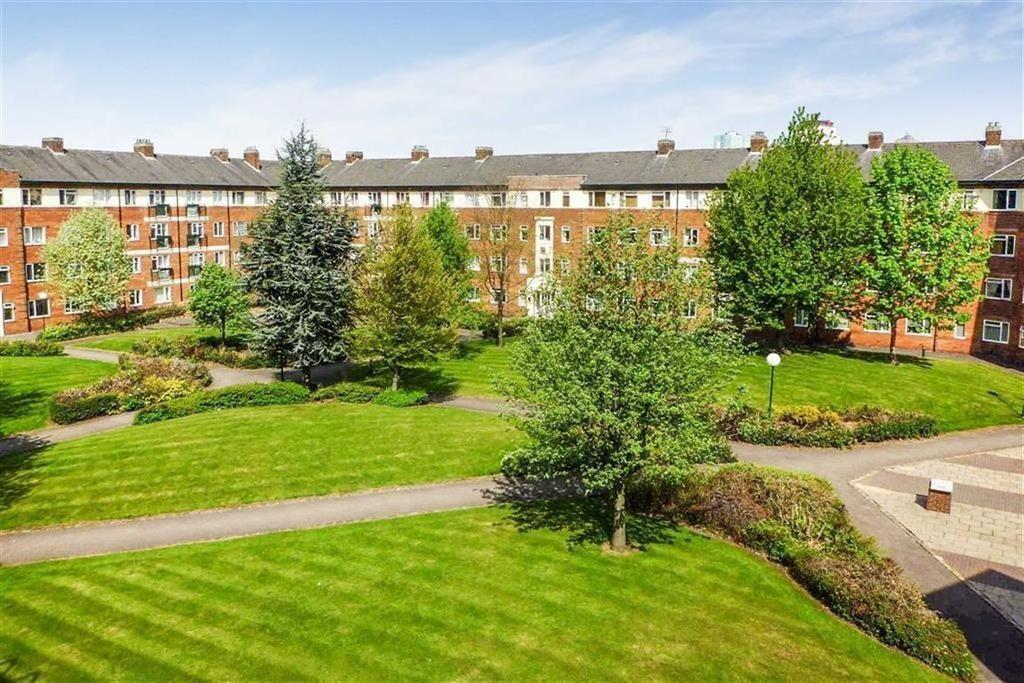 A beautifully maintained communal garden area s...
