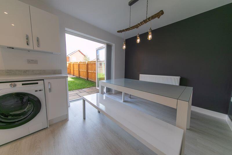 Dining area and double doors to garden