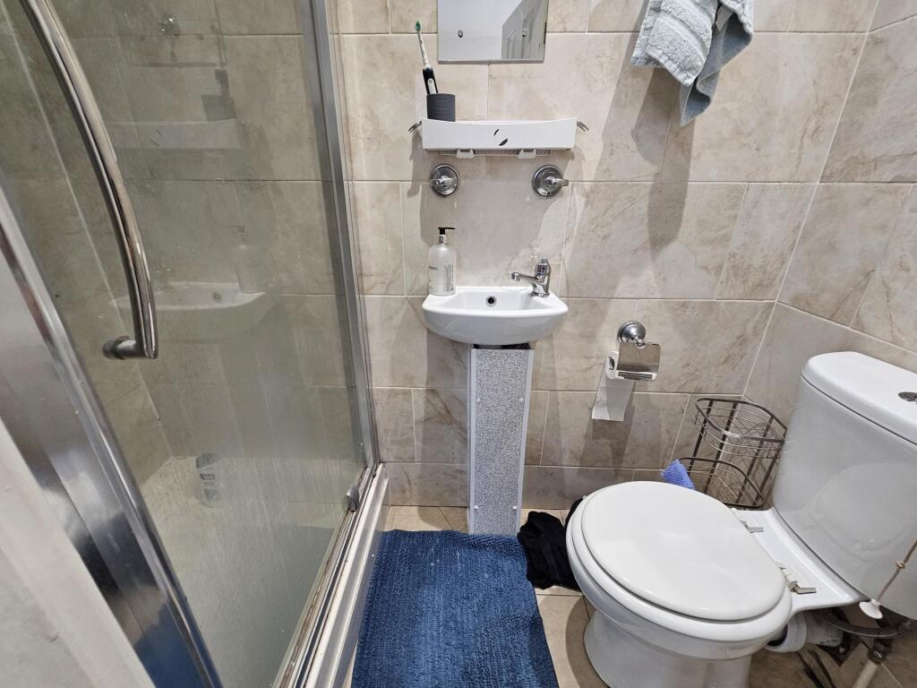 A clean and well-maintained bathroom with a sin...