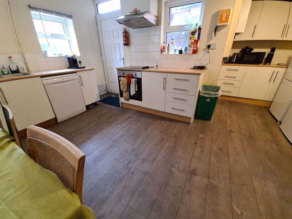 A bright and well-maintained kitchen with ample...