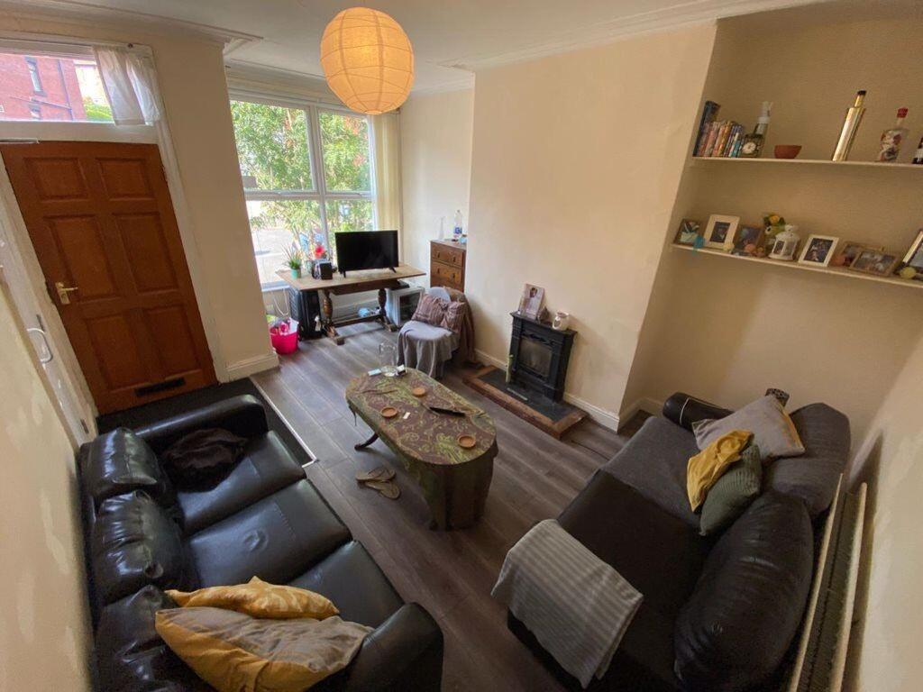 Bright and welcoming living room featuring comf...