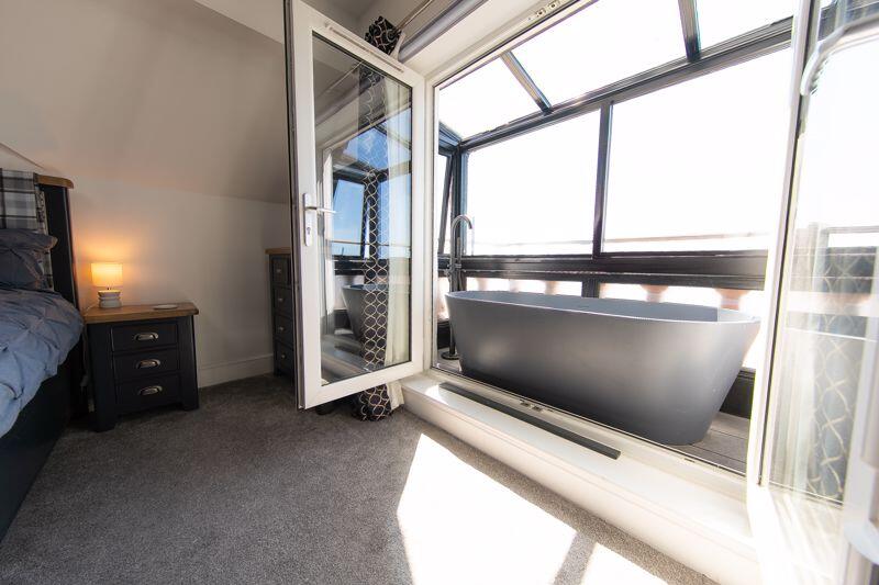 Bedroom 1 private balcony bathtub