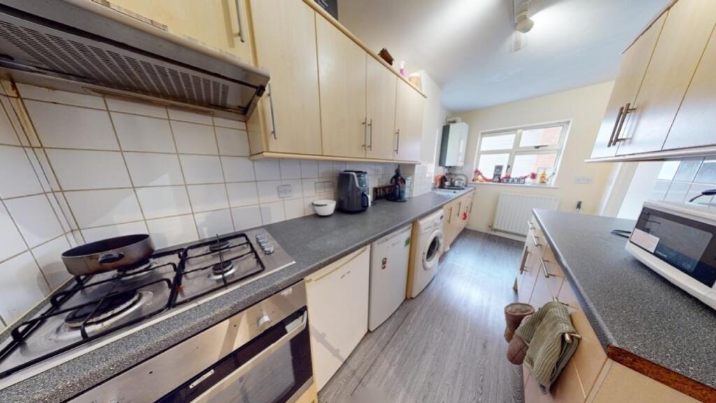 A bright and functional kitchen featuring moder...