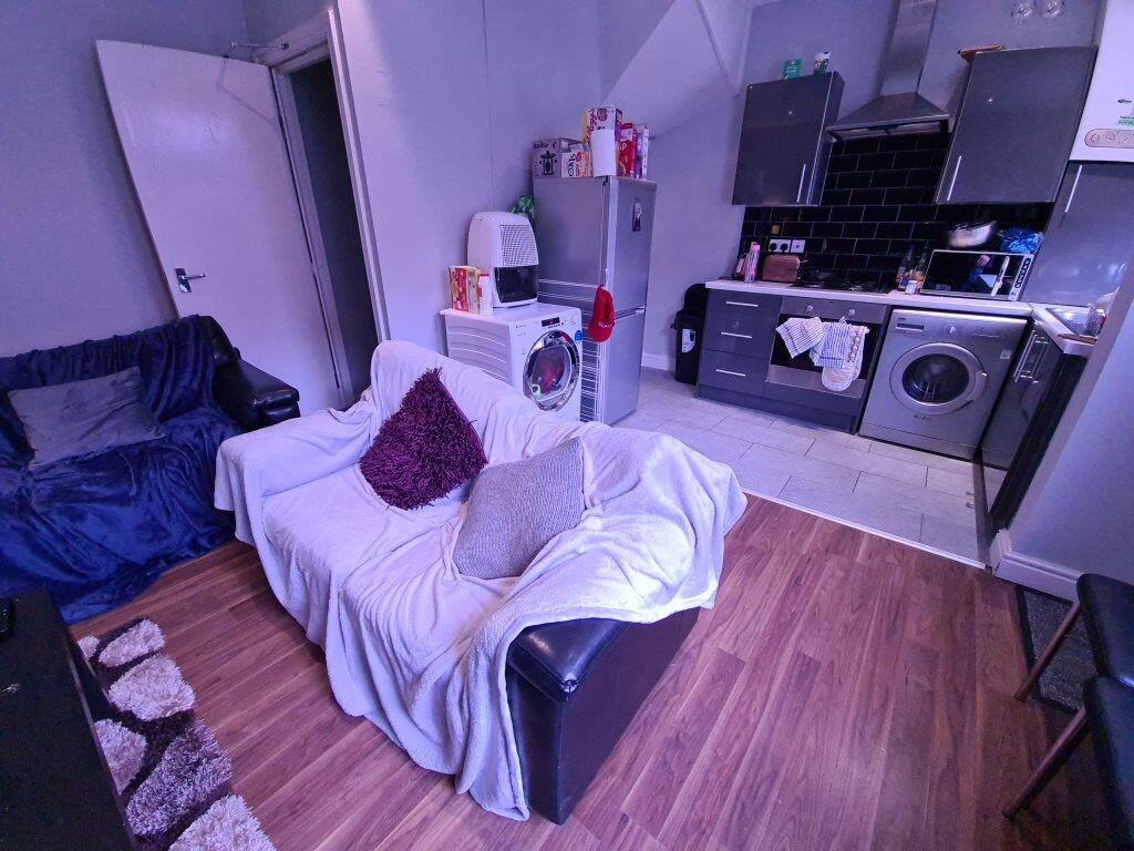 Cozy living room with a comfortable sofa, woode...