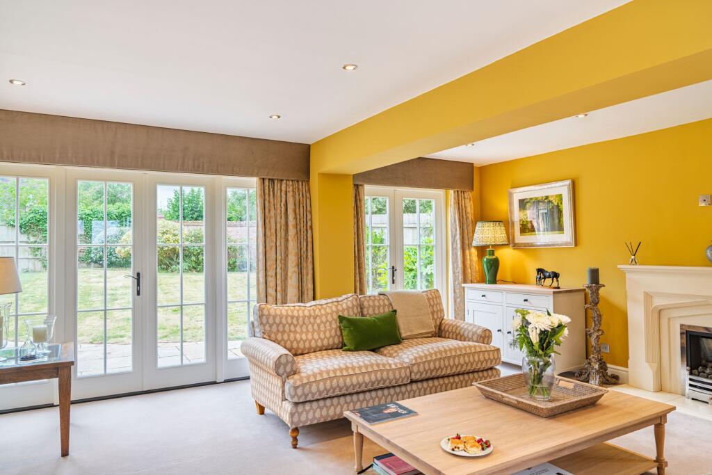 Patio doors on both sides of the Living room