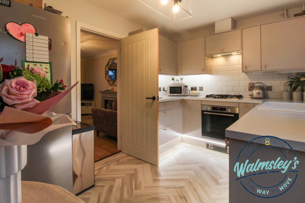 Kitchen with sitting room beyond