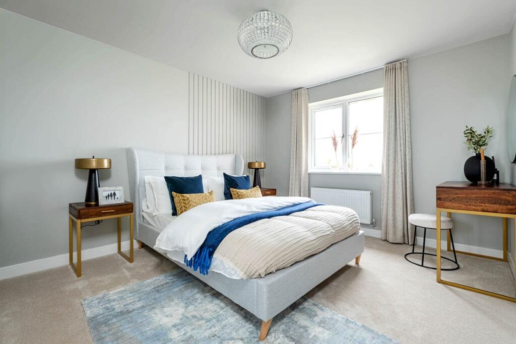 The spacious main bedroom with en suite