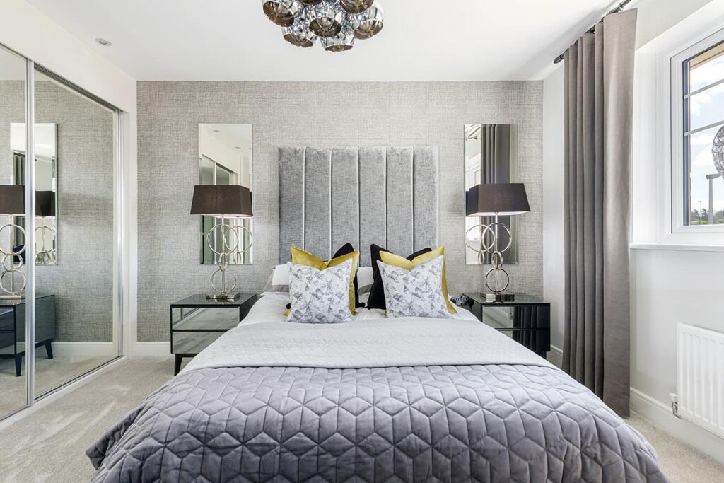 Bedroom two benefits from a private en suite