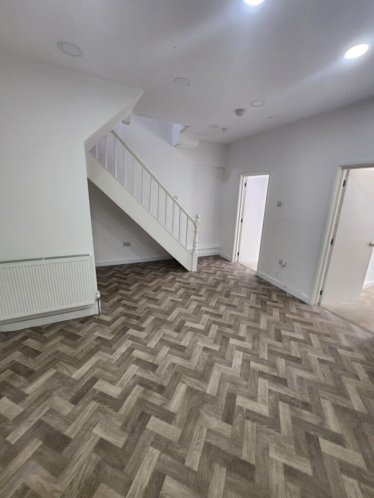 Bright and clean hallway featuring stylish herr...