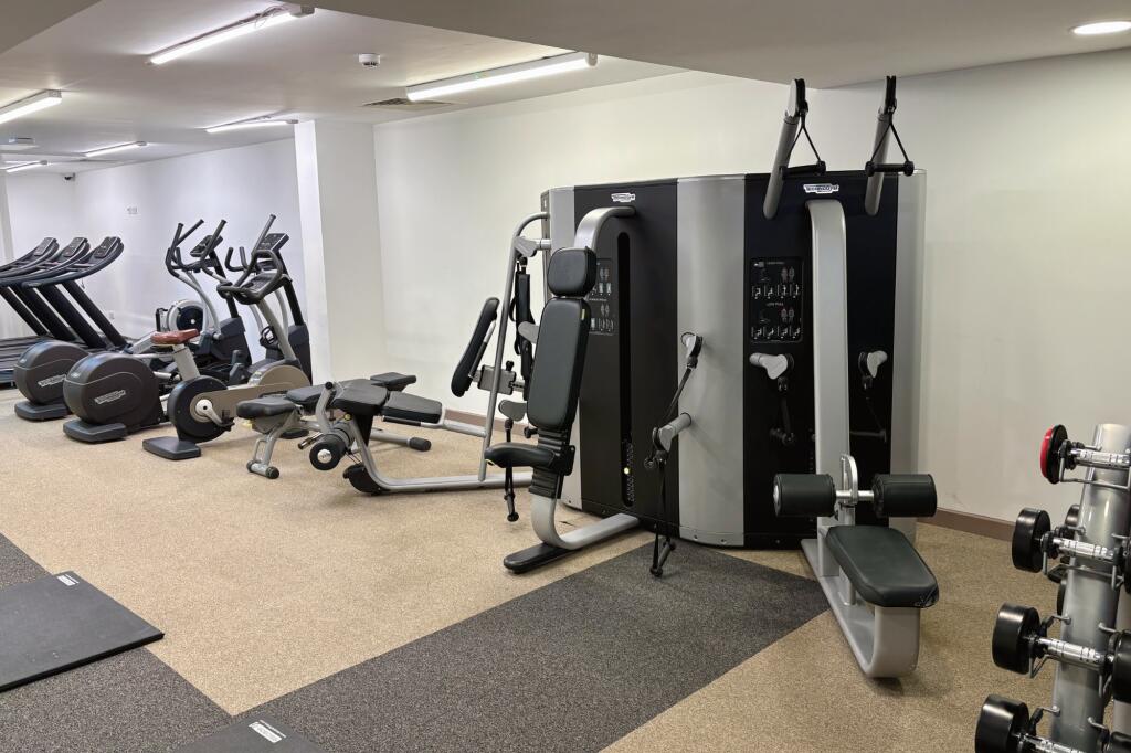 Modern gym equipped with a variety of exercise ...