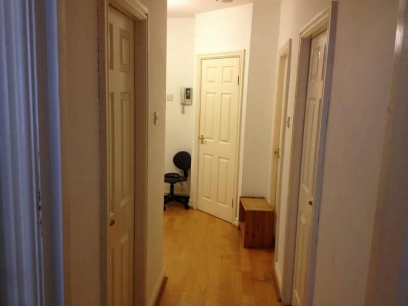 A clean and simple hallway with wooden flooring...