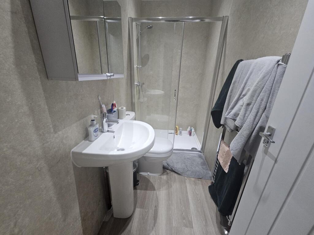 A clean and well-maintained bathroom featuring ...