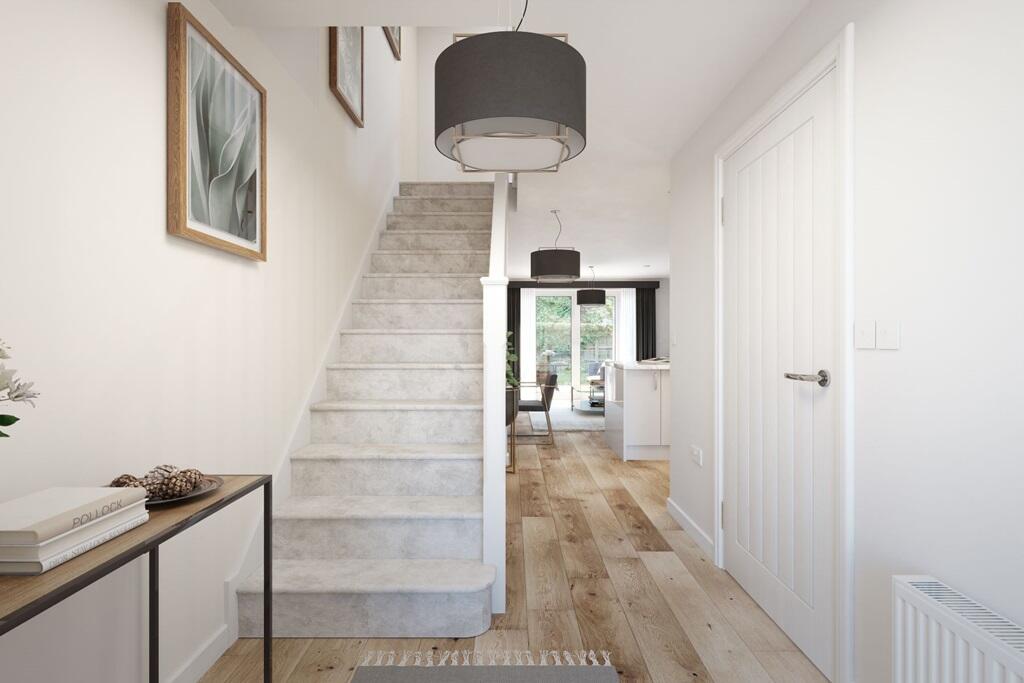 A welcoming hallway leading to the open plan kitchen &amp; dining area