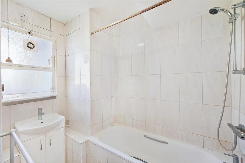 Bright and clean bathroom featuring a modern wh...
