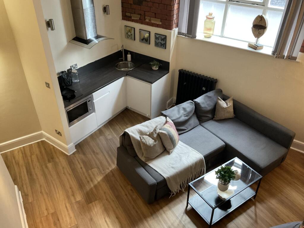 Modern living room with stylish wooden flooring...
