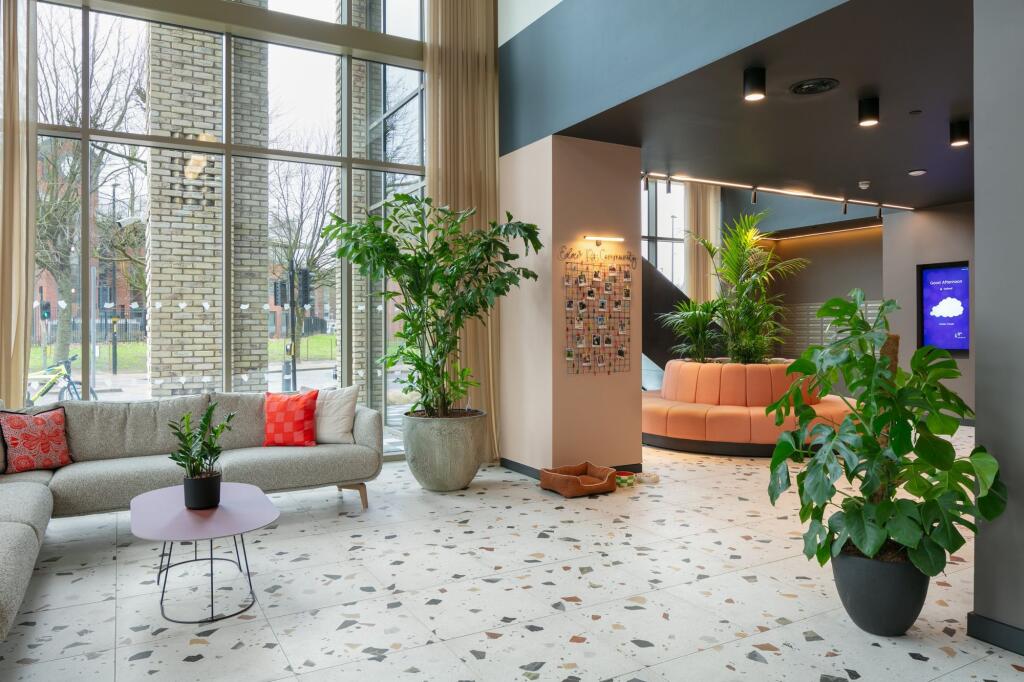 A stylish and spacious communal lounge featurin...