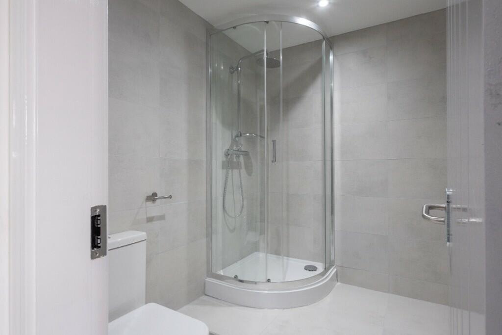 A modern bathroom featuring a sleek design with...