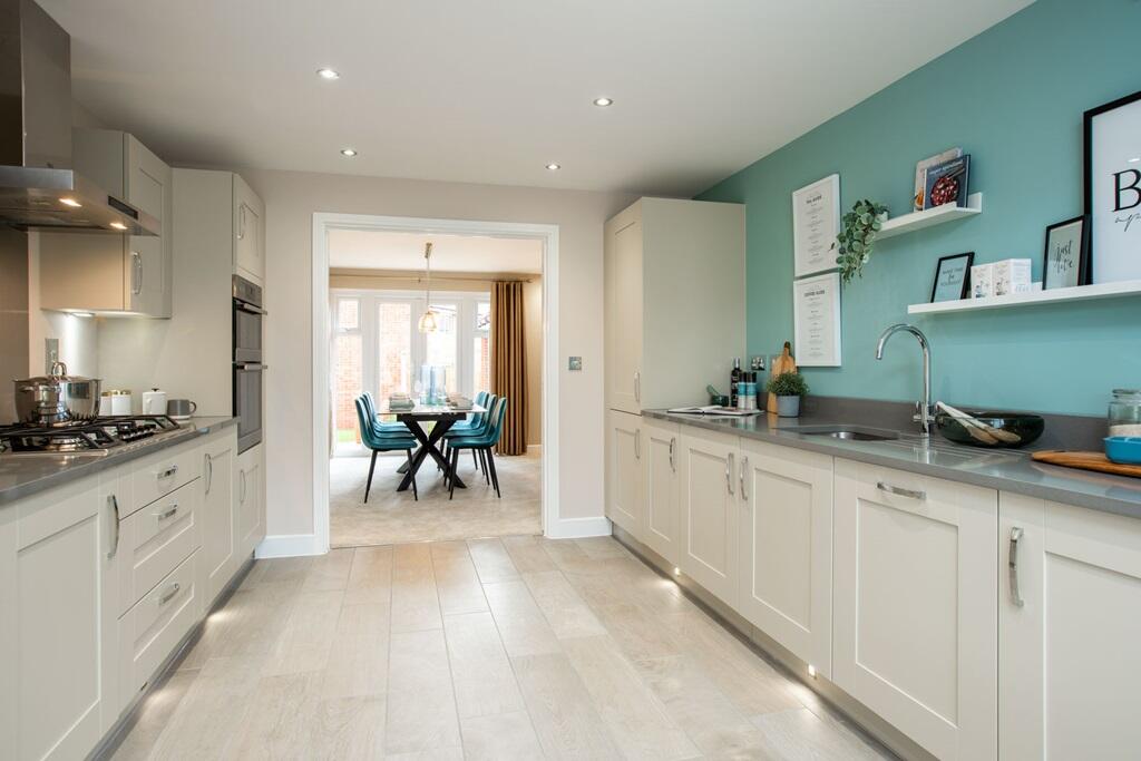 The kitchen leads to the family-friendly dining room