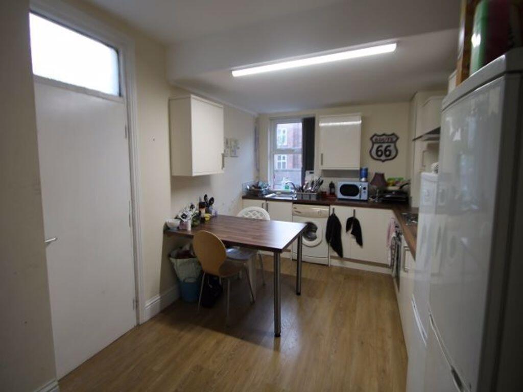 A bright and functional kitchen featuring woode...