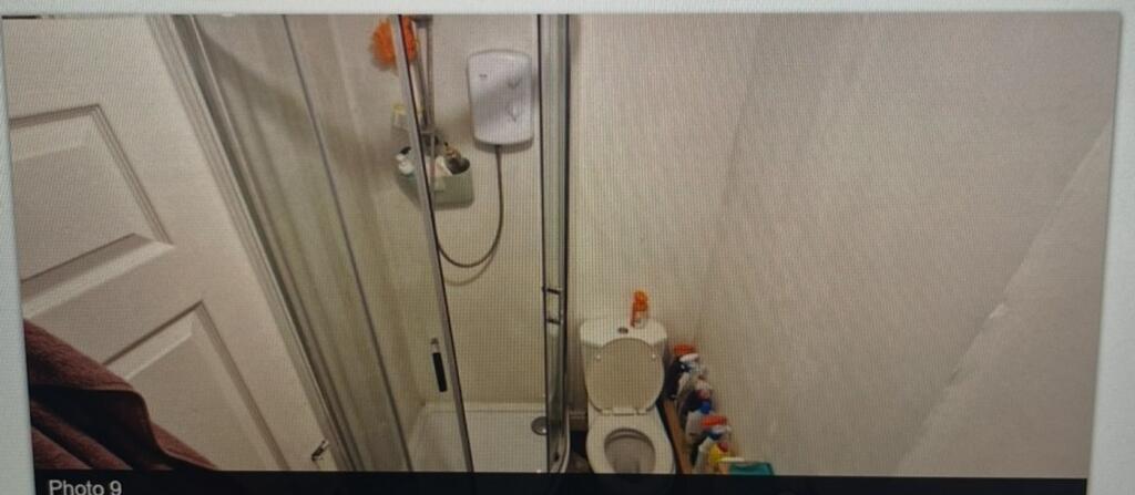 A functional bathroom featuring a shower and es...