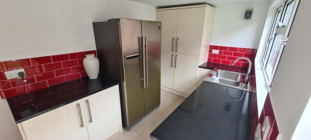 A bright and modern kitchenette featuring sleek...