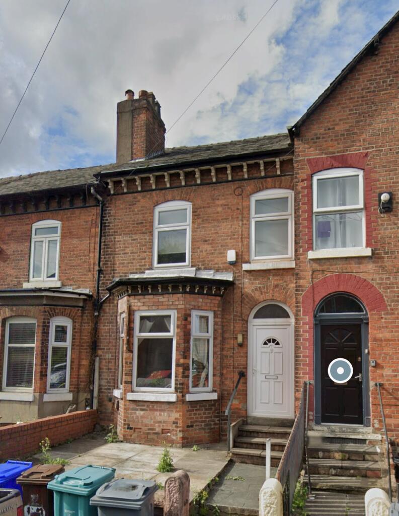 Traditional brick terraced house exterior with ...