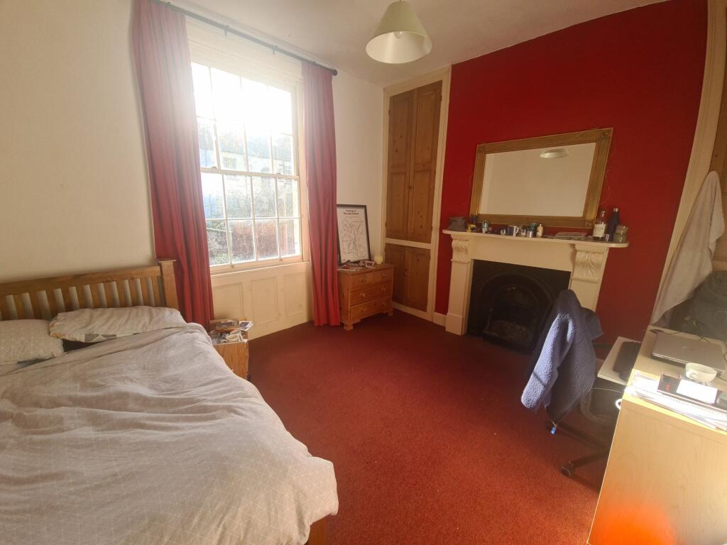 A welcoming bedroom featuring a comfortable bed...