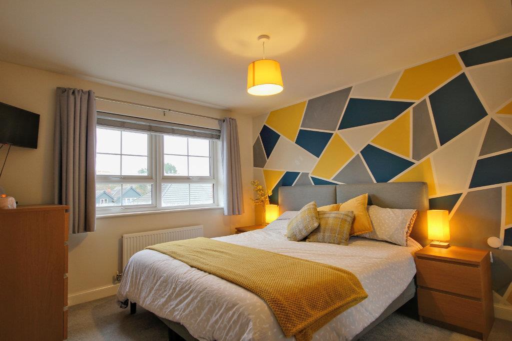 Bedroom One with fitted sliderobes