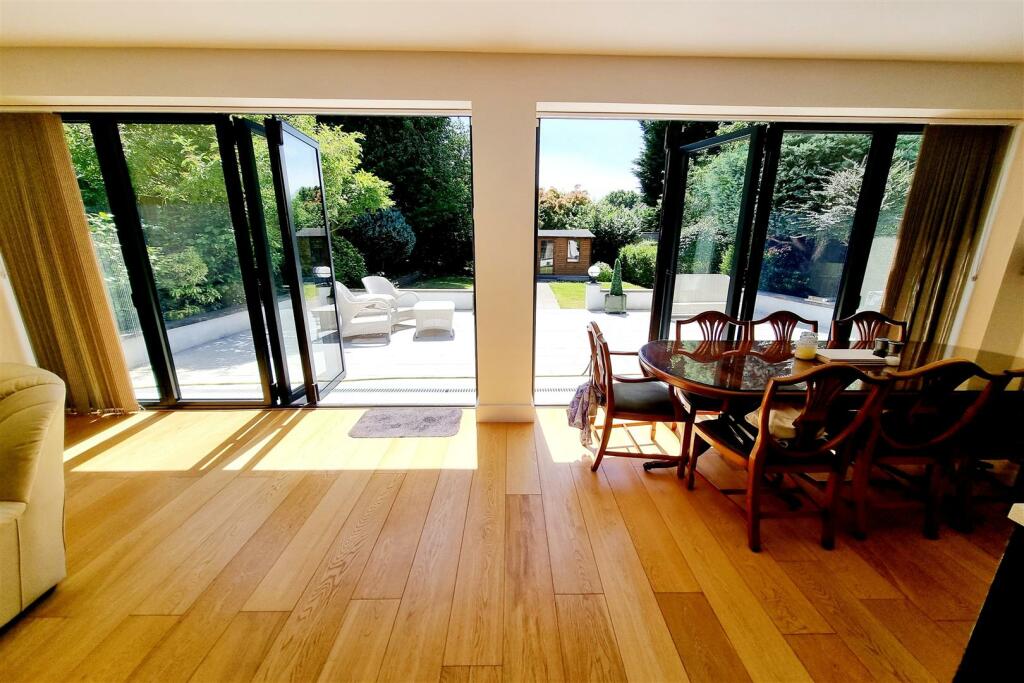 2 SETS OF BI-FOLDING DOORS &amp; DINING AREA: