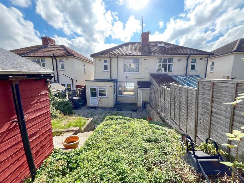 Rear view of property and patio (1).jpg